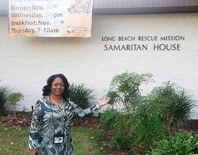 Aisha Henderson in the El Segundo, Calif., office of the Aerospace and Sciences Engineering Division delivers food and supplies to the residents of the Long Beach Rescue Mission at Thanksgiving.
